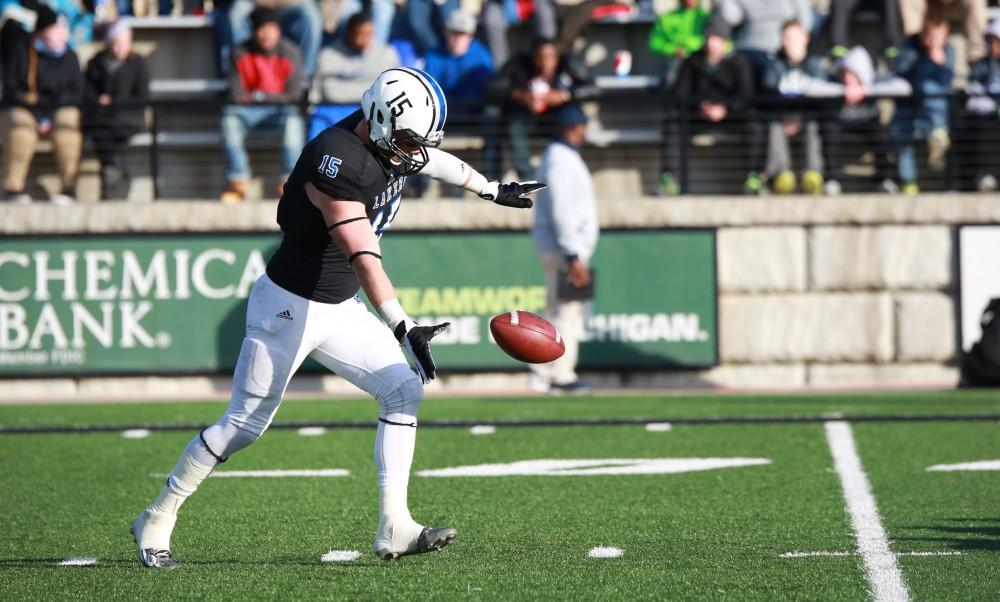 GVL / Kevin Sielaff -  Jamie Potts (15) punts the ball to safety.  Grand Valley squares off against SVSU Nov. 14 in Allendale. The Lakers hold on and win with a final score of 24-17.