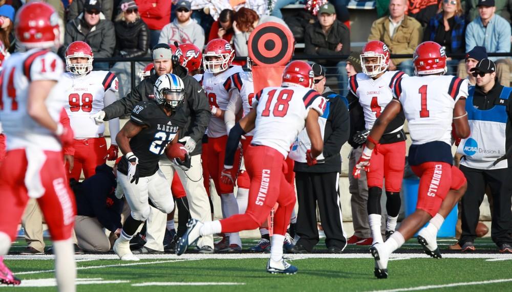 GVL / Kevin Sielaff - Kirk Spencer (27) carries the ball up field.  Grand Valley squares off against SVSU Nov. 14 in Allendale. The Lakers hold on and win with a final score of 24-17.