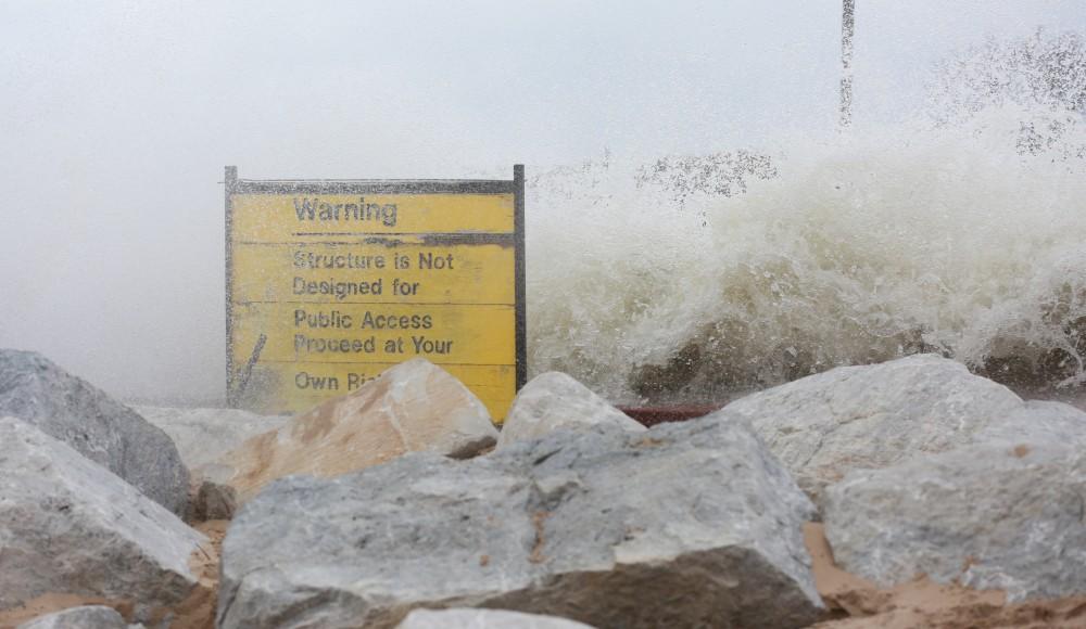 GVL / Kevin Sielaff - Large waves slam the shoreline of Grand Haven State Park Nov. 14.