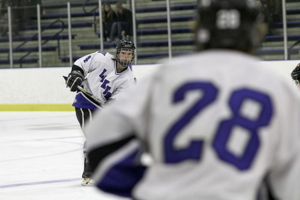 GVL / Sara Carte
Grand Valley’s DII Hockey player, Tom Lusynksi (left), passes to his teammate, Lucas Little (right), against Ferris State at Georgetown Ice Arena on Oct. 30.