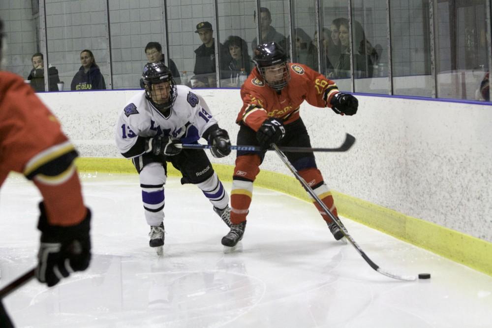 GVL / Sara Carte
Grand Valley’s DII Hockey player, Tony Russo, fights for the puck against Ferris State at Georgetown Ice Arena on Oct. 30.