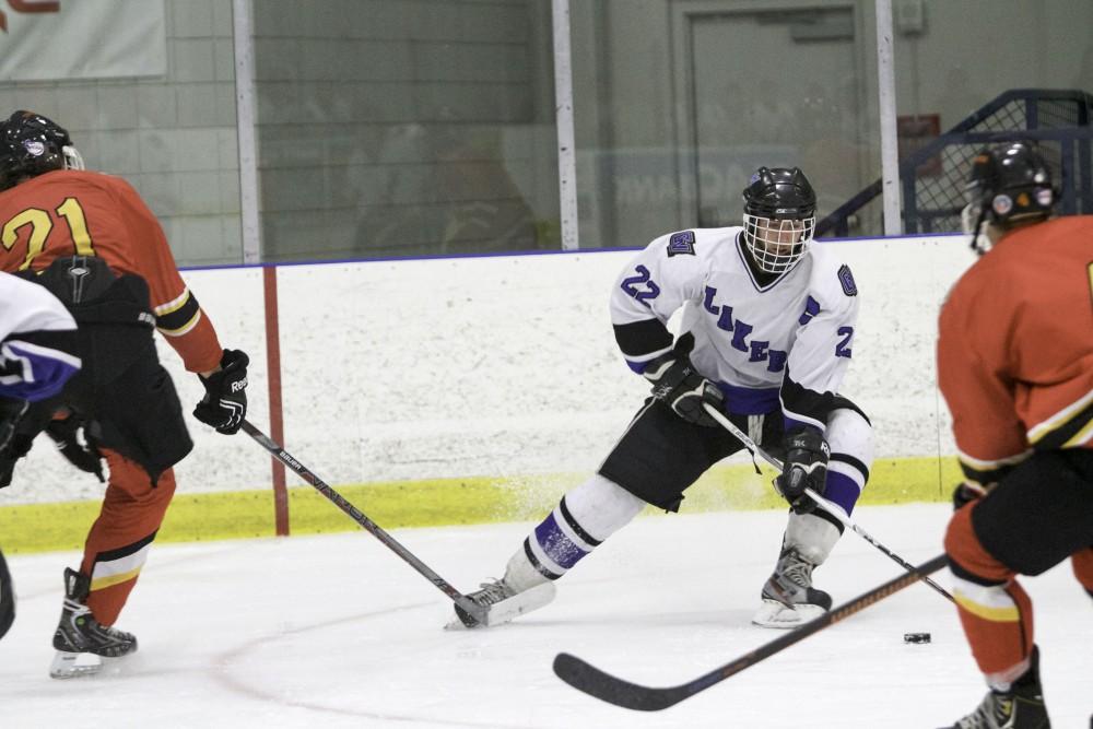 GVL / Sara Carte
Grand Valley’s DII Hockey player, Zac Strain, keeps the puck away from Ferris State at Georgetown Ice Arena on Oct. 30.