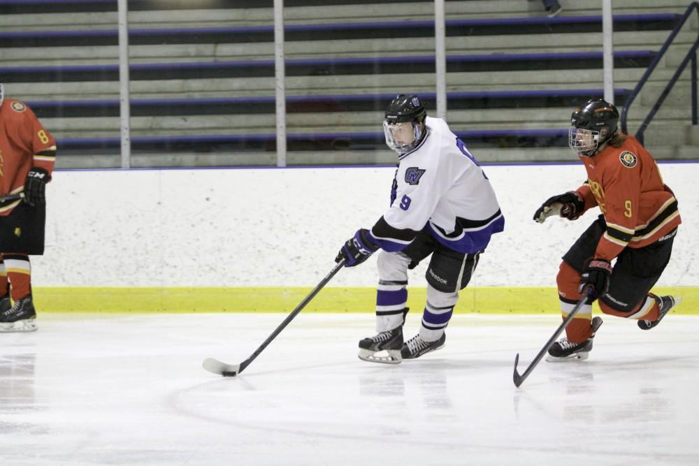 GVL / Sara Carte
Grand Valley’s DII Hockey player, Spencer Godin, keeps the puck away from Ferris State at Georgetown Ice Arena on Oct. 30.