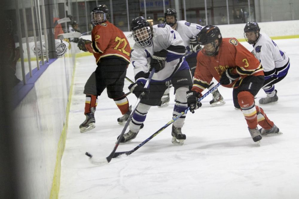 GVL / Sara CarteGrand Valley’s DII Hockey player, Cameron Dyde, keeps the puck away from Ferris State at Georgetown Ice Arena on Oct. 30.