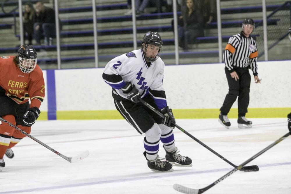 GVL / Sara Carte
Grand Valley’s DII Hockey player, Troy Marrett, runs the puck down the ice against Ferris State at Georgetown Ice Arena on Oct. 30.