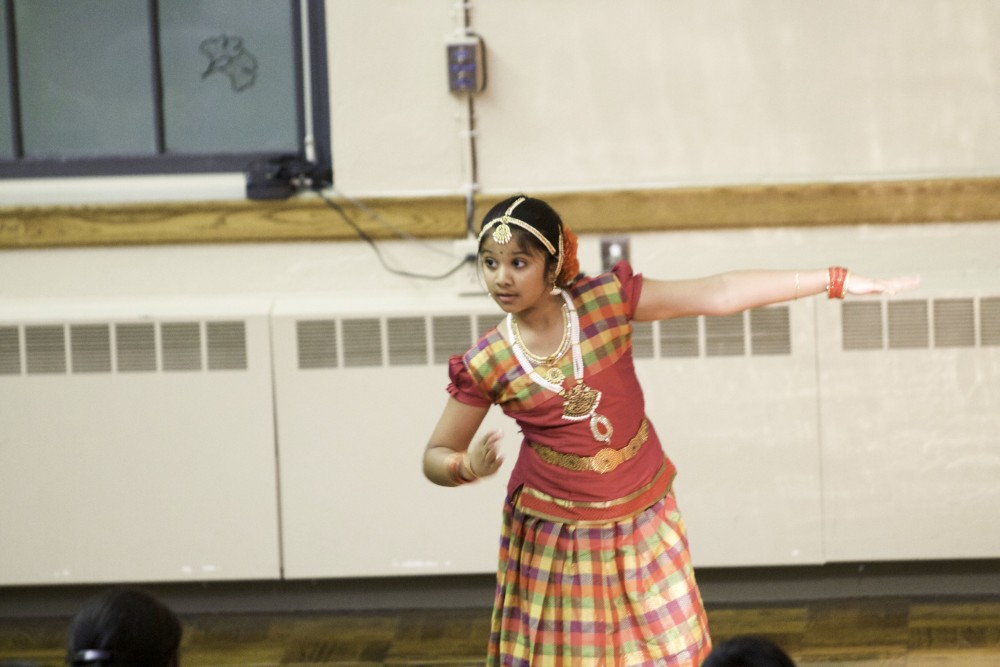 GVL / Sara Carte
A member of the West Michigan Hindu Temple dances a traditional dance during the Interfaith Diwali Celebration at the Fountain Street Church on Oct. 30.