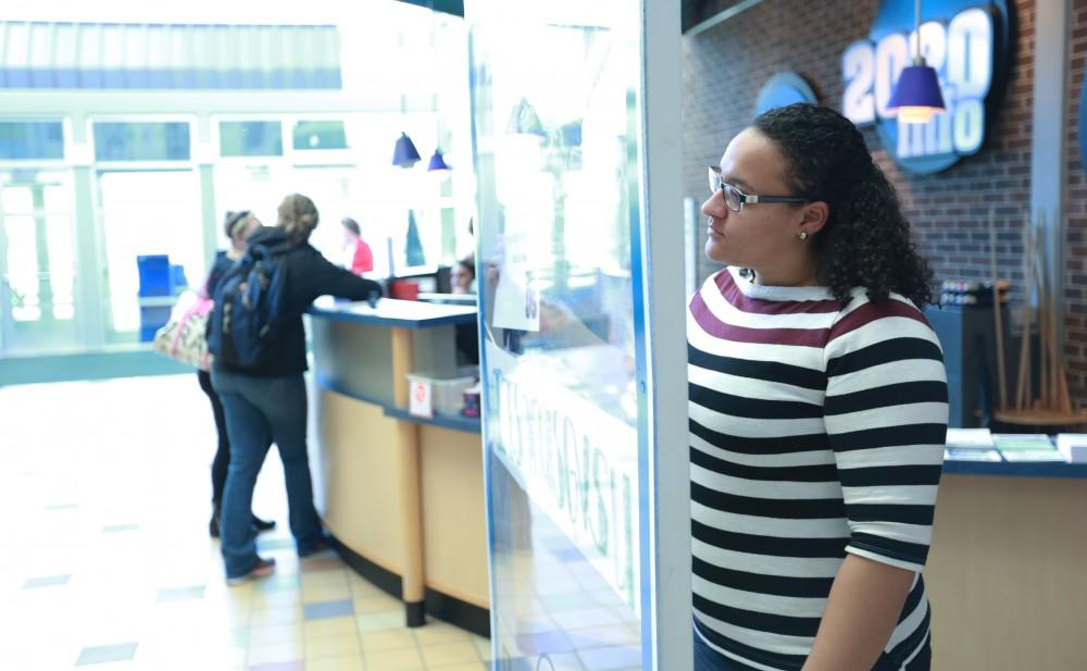 GVL / Kevin Sielaff - Samantha Przybylski holds a sign behind the "It's On Us" social media stand on Nov. 10 inside the Kirhof Center. 