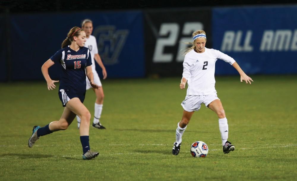 GVL / Kevin Sielaff - Katie Klunder (2) pushes the ball up field.  Grand Valley defeats Malone in the first round of the GLIAC tournament with a final score of 6-0 Nov. 4 in Allendale.