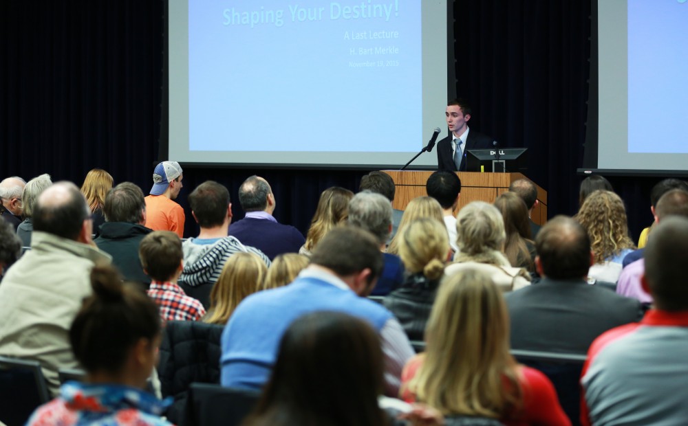 GVL / Kevin Sielaff - Sean O'Melia addresses the crowd and introduces Bart Merkle. Dean of students Bart Merkle speaks at student senate's Last Lecture Nov. 19 at Grand Valley's Mary Idema Pew Library.