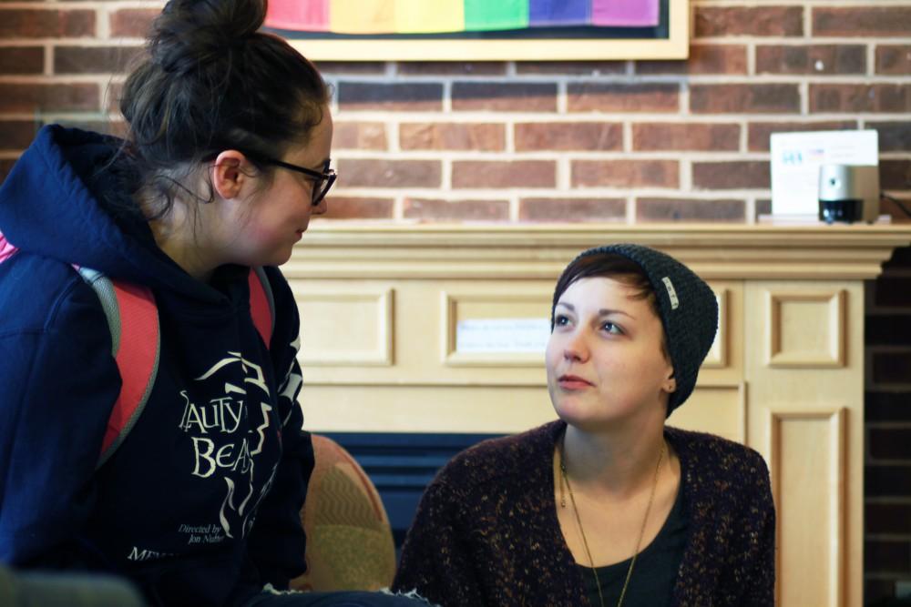 Darien Kent, junior, talks with Tyler Konell, freshman, in the LGBT Resource Center on Nov. 13 in Allendale, MI. 