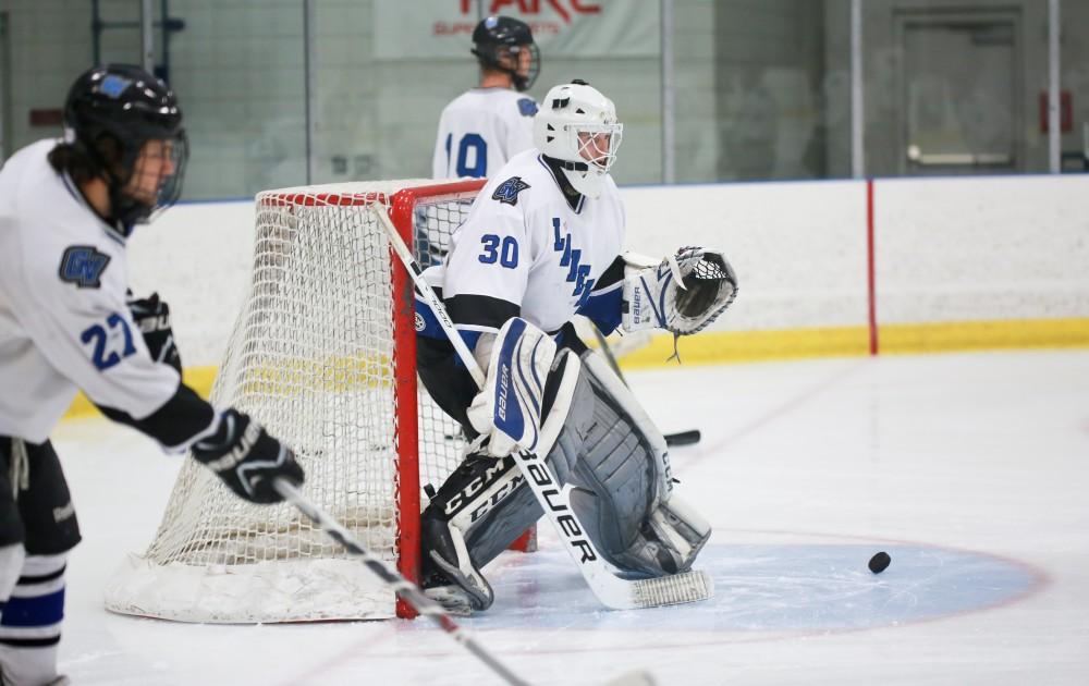 GVL / Kevin Sielaff - Goal tender Spencer Craig (30) warms up before the game.  The Lakers square off against the Rockets from the University of Toledo Nov. 6 in Allendale.