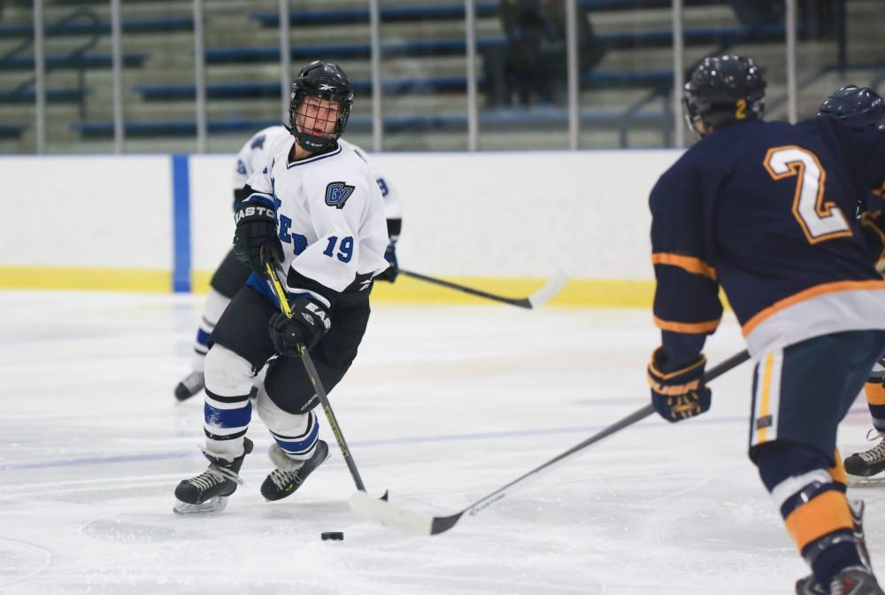 GVL / Kevin Sielaff - Collin Finkhouse (19) skates in toward the net.  The Lakers square off against the Rockets from the University of Toledo Nov. 6 in Allendale.