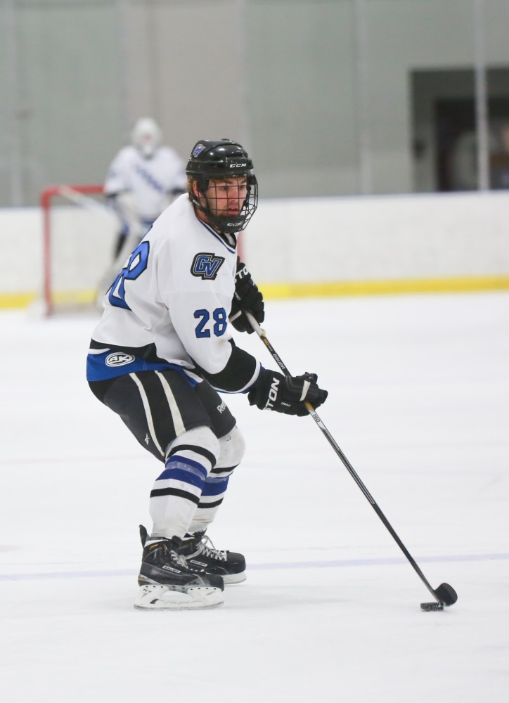 GVL / Kevin Sielaff - Lucas Little (28) sets up a Grand Valley power play.  The Lakers square off against the Rockets from the University of Toledo Nov. 6 in Allendale.