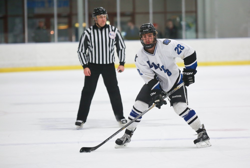 GVL / Kevin Sielaff - Lucas Little (28) sets up a Grand Valley power play.  The Lakers square off against the Rockets from the University of Toledo Nov. 6 in Allendale.