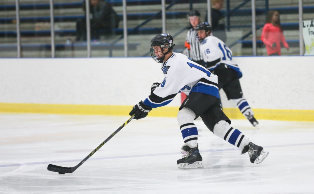 GVL / Kevin Sielaff - Collin Finkhouse (19) skates the puck up ice.  The Lakers square off against the Rockets from the University of Toledo Nov. 6 in Allendale.