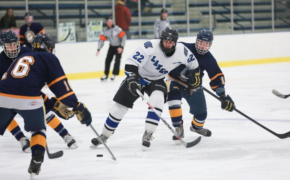 GVL / Kevin Sielaff - Zac Strain (22) loses the puck on his way to the net.  The Lakers square off against the Rockets from the University of Toledo Nov. 6 in Allendale.