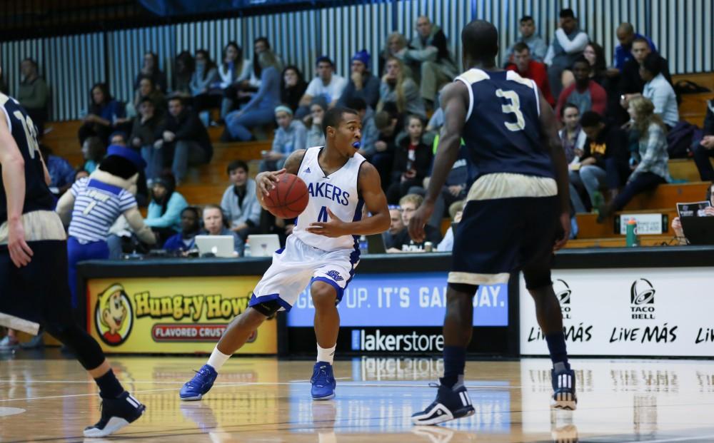 GVL / Kevin Sielaff - Sam McClendon (4) looks for an outlet pass.  The Laker basketball squad defeats Grace Bible College with a final score of 83-57 Nov. 23 in the fieldhouse arena.