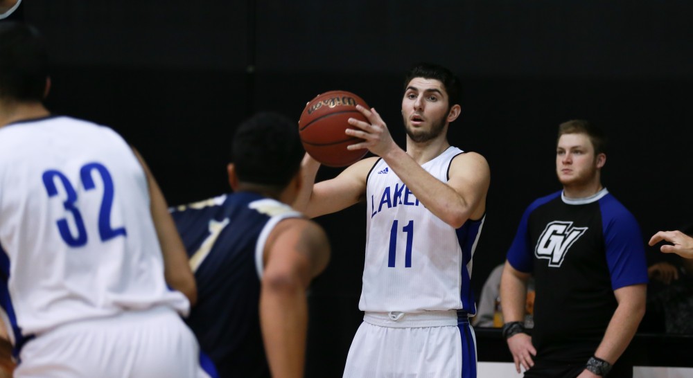 GVL / Kevin Sielaff - Zach West (11) looks for an outlet pass.  The Laker basketball squad defeats Grace Bible College with a final score of 83-57 Nov. 23 in the fieldhouse arena.