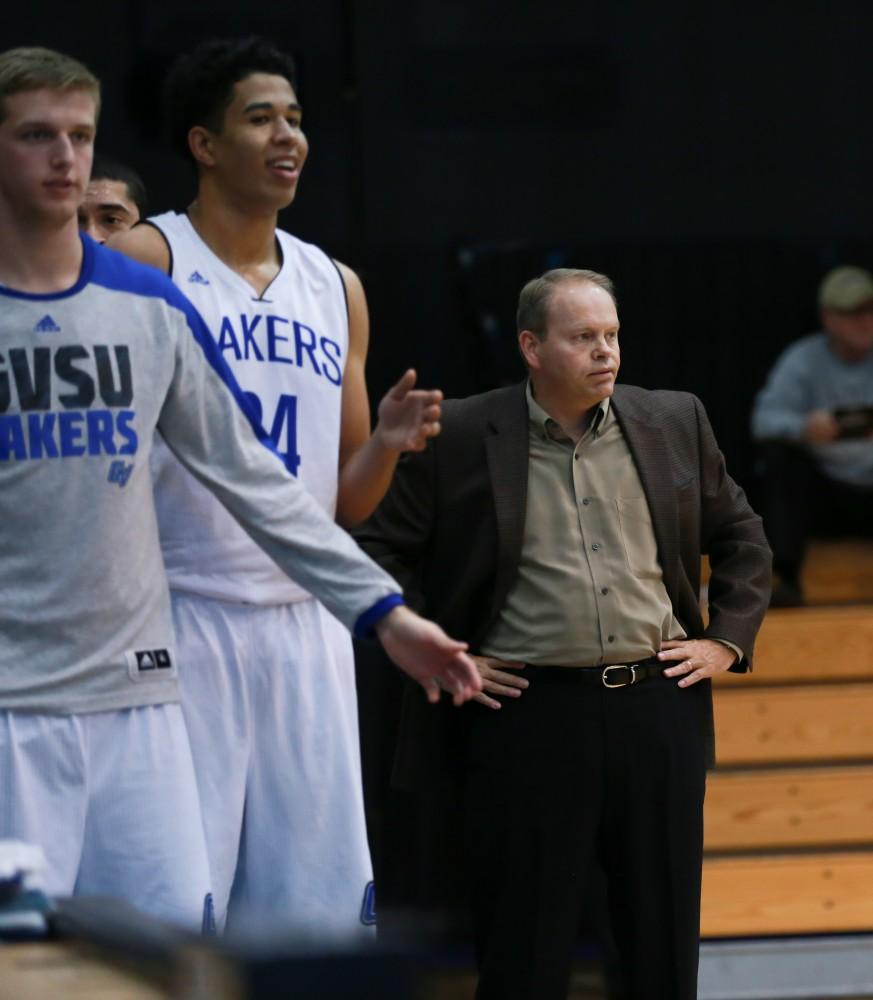 GVL / Kevin Sielaff - Head coach Ric Wesley looks on toward the play during the first half.  The Laker basketball squad defeats Grace Bible College with a final score of 83-57 Nov. 23 in the fieldhouse arena.