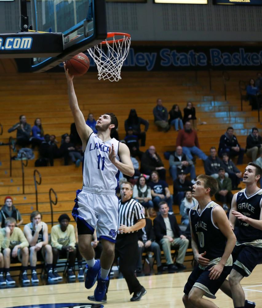 GVL / Kevin Sielaff - Zach West (11) goes in for a layup.  The Laker basketball squad defeats Grace Bible College with a final score of 83-57 Nov. 23 in the fieldhouse arena.