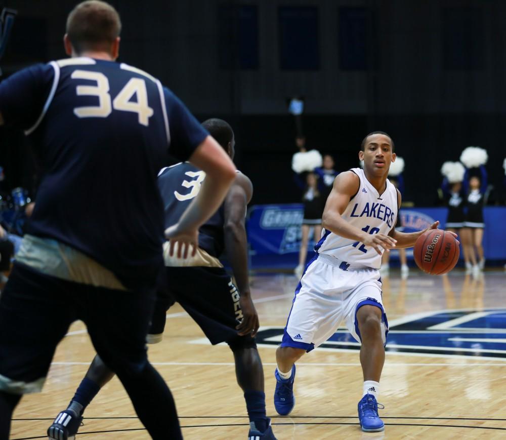 GVL / Kevin Sielaff - Myles Miller (12) looks for a pass down the lane.  The Laker basketball squad defeats Grace Bible College with a final score of 83-57 Nov. 23 in the fieldhouse arena.