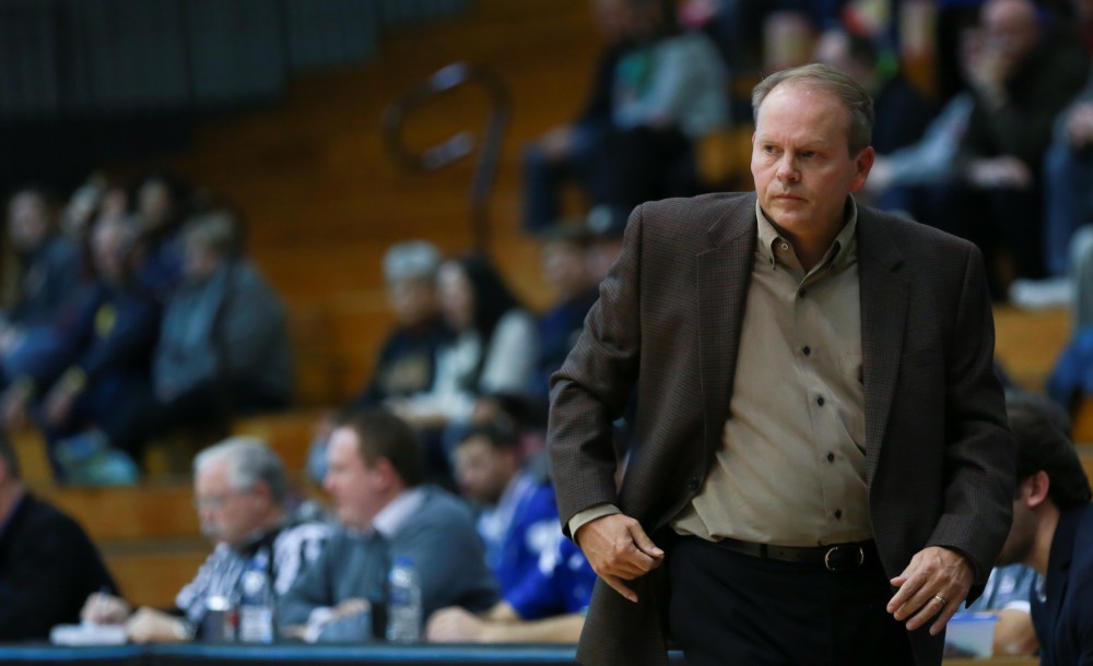 GVL / Kevin Sielaff - Head coach Ric Wesley looks on toward the play.  The Laker basketball squad defeats Grace Bible College with a final score of 83-57 Nov. 23 in the fieldhouse arena.