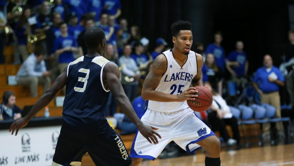 GVL / Kevin Sielaff - Chaz Rollins (25) posesses the ball near the free-throw line.  The Laker basketball squad defeats Grace Bible College with a final score of 83-57 Nov. 23 in the fieldhouse arena.