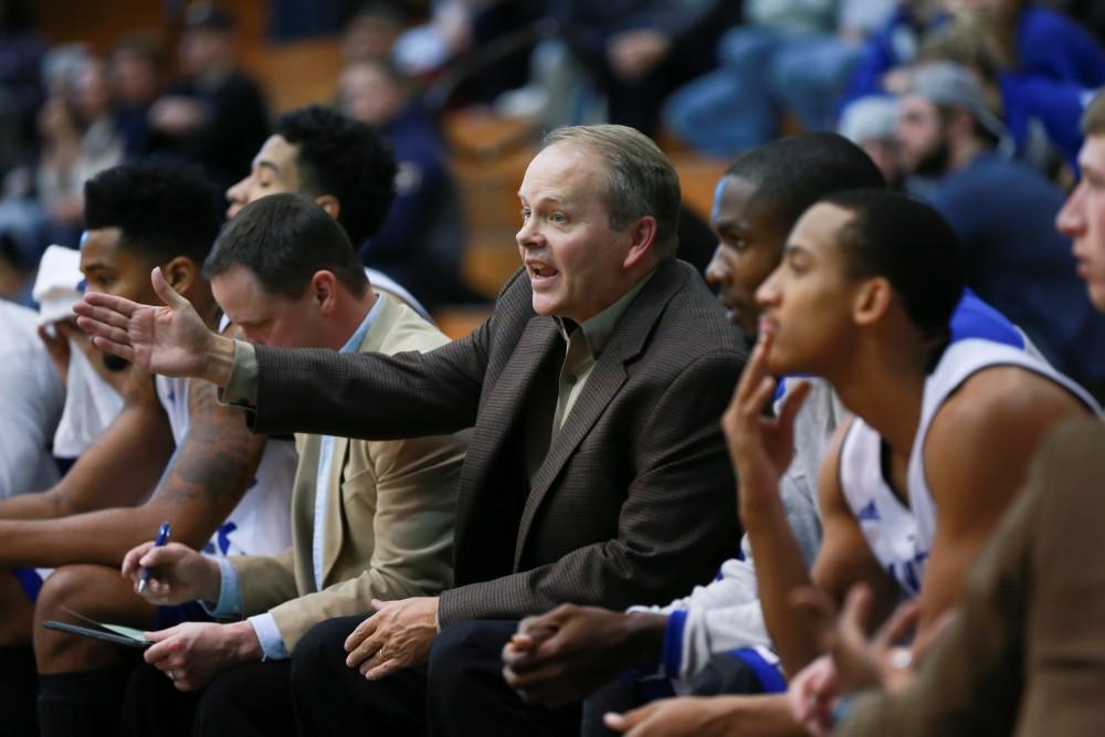 GVL / Kevin Sielaff - Head coach Ric Wesley looks on to the play.  The Laker basketball squad defeats Grace Bible College with a final score of 83-57 Nov. 23 in the fieldhouse arena.