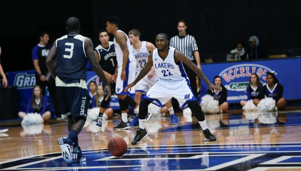 GVL / Kevin Sielaff - Juwan Starks (22) back-peddles and defends a Grace Bible attack.  The Laker basketball squad defeats Grace Bible College with a final score of 83-57 Nov. 23 in the fieldhouse arena.