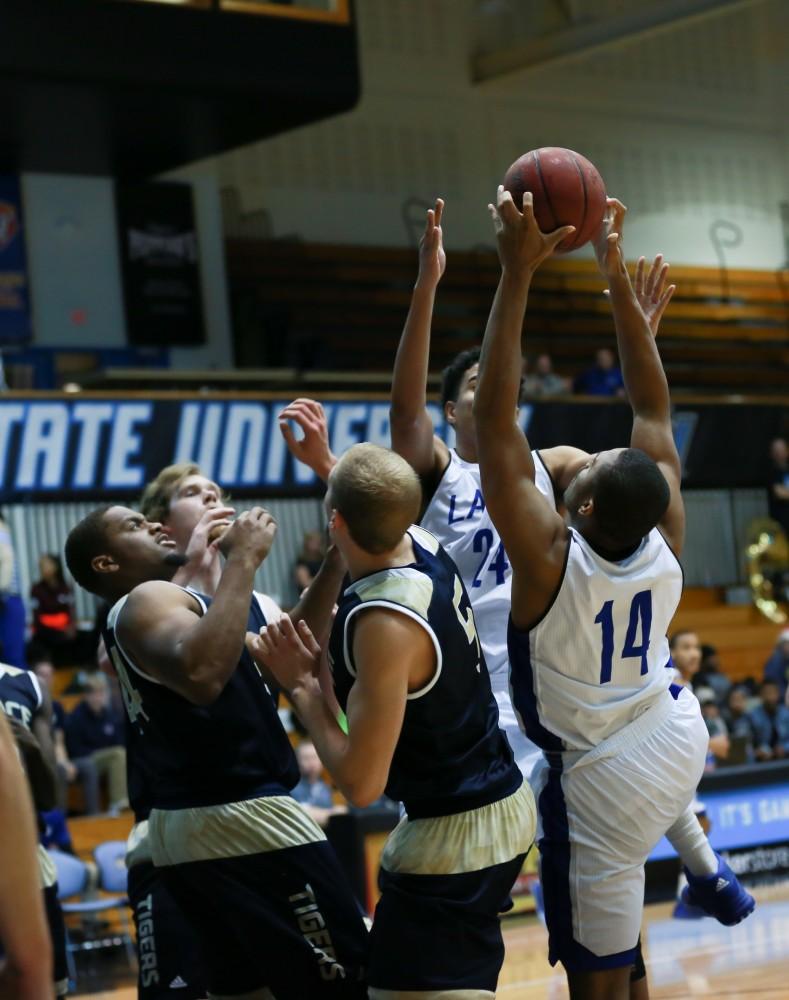 GVL / Kevin Sielaff - Harold Wiggins (14) grabs an offensive board.  The Laker basketball squad defeats Grace Bible College with a final score of 83-57 Nov. 23 in the fieldhouse arena.