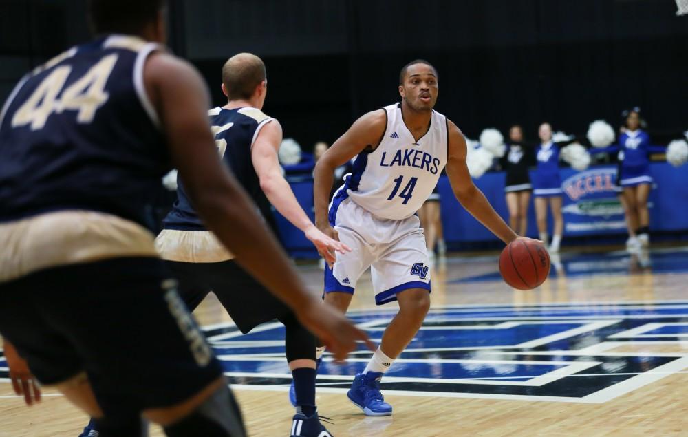 GVL / Kevin Sielaff - Harold Wiggins (14) looks to pass the ball.  The Laker basketball squad defeats Grace Bible College with a final score of 83-57 Nov. 23 in the fieldhouse arena.