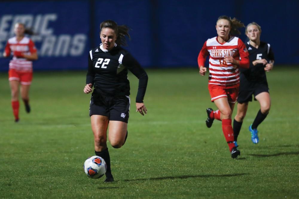GVL / Kevin Sielaff -  Samantha Riga (22) pushes the ball up field. The Lakers defeat the Bulldogs with a final score of 2-0 Oct. 30 in Allendale. Grand Valley will advance to the GLIAC tournament starting Nov. 3.
