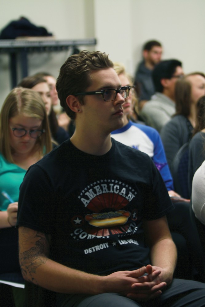 Patrick Miller sits in on the Transgender Remembrance day on Nov. 17 in Allendale, MI. 