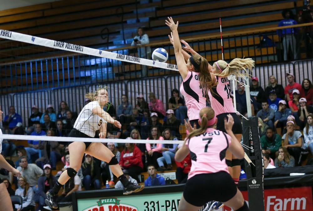 GVL / Kevin Sielaff - Jillian Butsavich (12) and Shannon Winicki (18) rise up for a block. Grand Valley squares off against Ohio Dominican and claims the victory with a final score of 3-1.