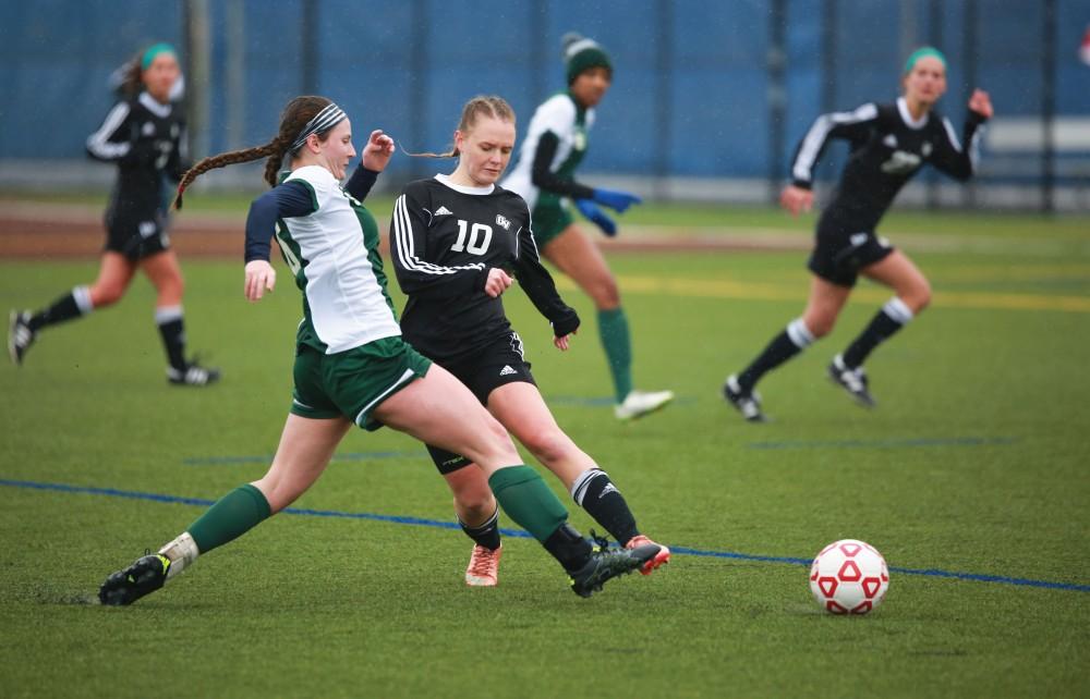 GVL / Kevin Sielaff - Monika Sosnowka (10) fights for the ball in Grand Valley's zone.  Grand Valley's women's club soccer team squares off against Michigan State on a rainy Oct. 31. The Lakers were defeated, with a final score of 2-0 in favor of Michigan State.