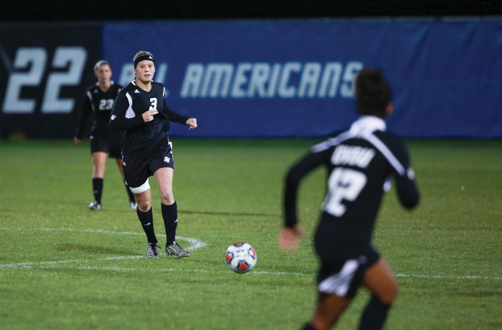 GVL / Kevin Sielaff -  Gabbie Guibord (3) passes the ball to Jayma Martin (12).  The Lakers defeat the Bulldogs with a final score of 2-0 Oct. 30 in Allendale. Grand Valley will advance to the GLIAC tournament starting Nov. 3.