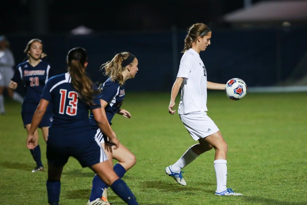 GVL / Kevin Sielaff - Gabriella Mencotti (20) prepares to cross the ball.  Grand Valley defeats Malone in the first round of the GLIAC tournament with a final score of 6-0 Nov. 4 in Allendale.