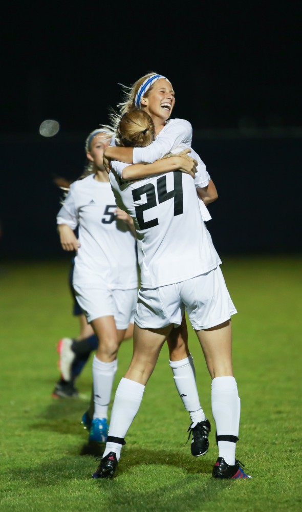 GVL / Kevin Sielaff - Katie Klunder (2) jumps for joy after opening the scoring with the game's first goal.  Grand Valley defeats Malone in the first round of the GLIAC tournament with a final score of 6-0 Nov. 4 in Allendale.