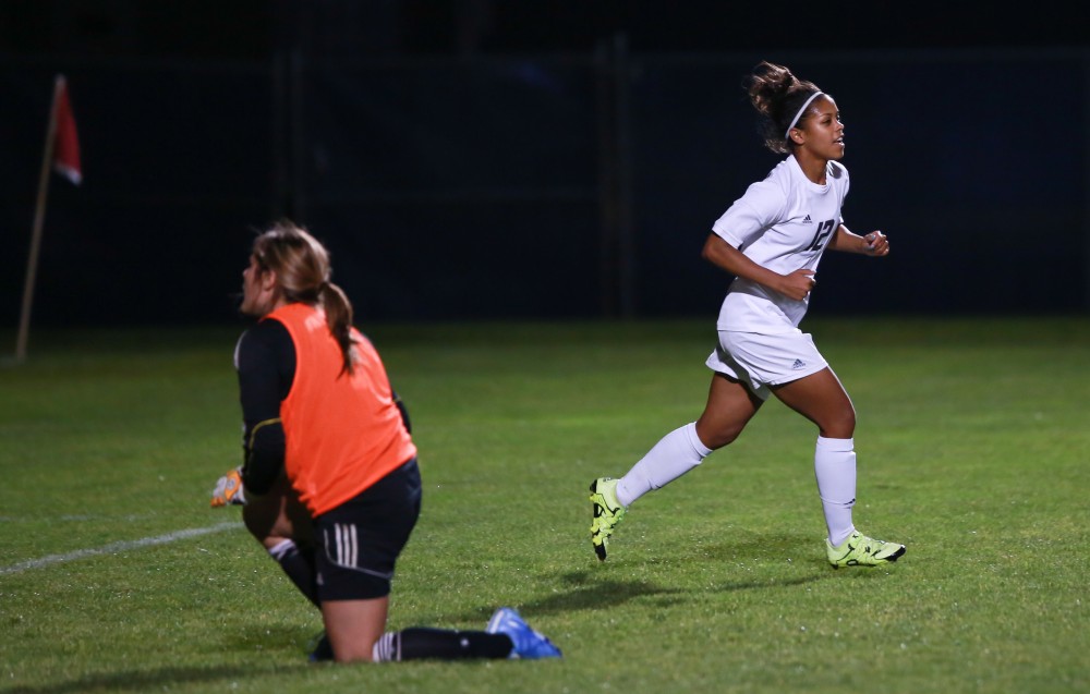 GVL / Kevin Sielaff - Jayma Martin (12) celebrates after scoring a goal.  Grand Valley defeats Malone in the first round of the GLIAC tournament with a final score of 6-0 Nov. 4 in Allendale.