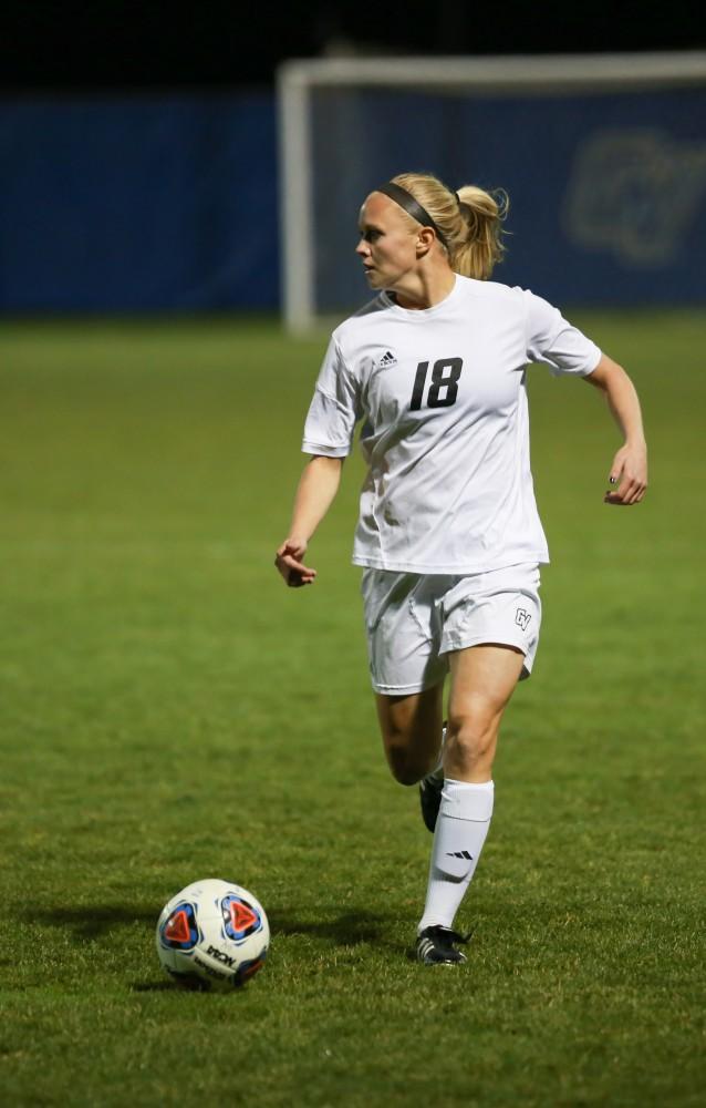 GVL / Kevin Sielaff - Maddison Reynolds (18) looks to pass the ball.  Grand Valley defeats Malone in the first round of the GLIAC tournament with a final score of 6-0 Nov. 4 in Allendale.