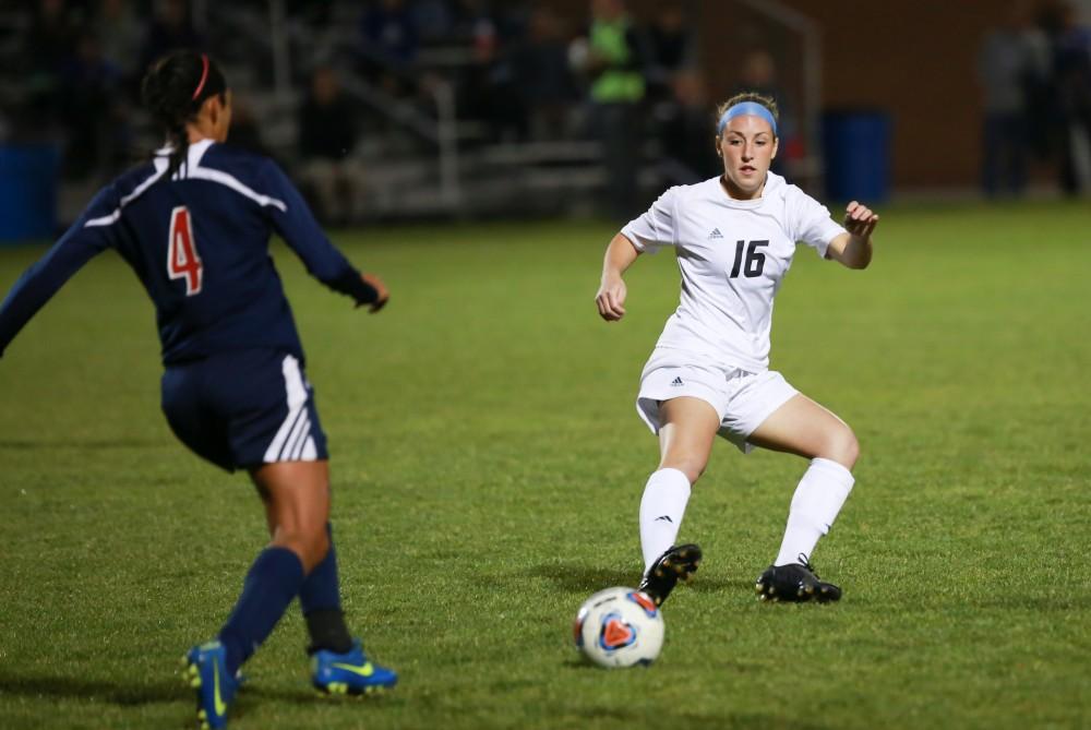 GVL / Kevin Sielaff - Dani Johnson (16) backs up after the ball falls into the hands of Malone's defense.  Grand Valley defeats Malone in the first round of the GLIAC tournament with a final score of 6-0 Nov. 4 in Allendale.