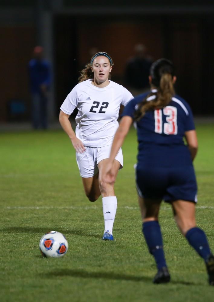 GVL / Kevin Sielaff - Samantha Riga (22) races toward the ball to try and maintain posession.  Grand Valley defeats Malone in the first round of the GLIAC tournament with a final score of 6-0 Nov. 4 in Allendale.