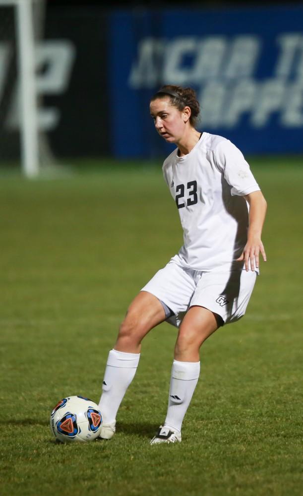 GVL / Kevin Sielaff - Katy Woolley (23) passes the ball.  Grand Valley defeats Malone in the first round of the GLIAC tournament with a final score of 6-0 Nov. 4 in Allendale.