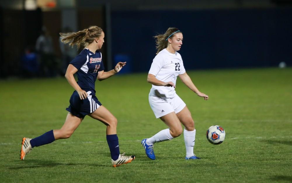 GVL / Kevin Sielaff - Samantha Riga (22) juggles the ball around midfield.  Grand Valley defeats Malone in the first round of the GLIAC tournament with a final score of 6-0 Nov. 4 in Allendale.