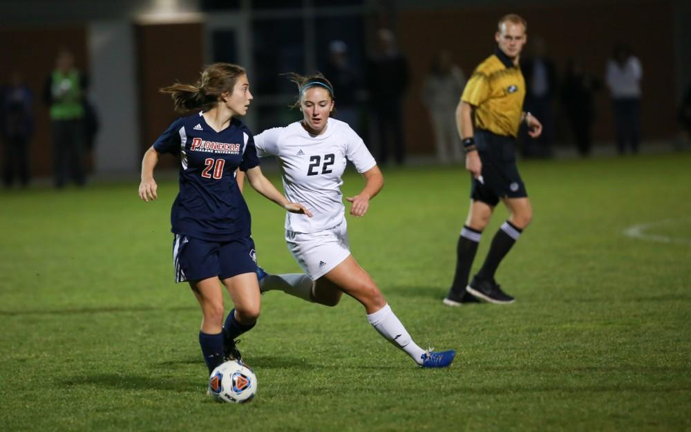 GVL / Kevin Sielaff - Samantha Riga (22) races to maintain posession.  Grand Valley defeats Malone in the first round of the GLIAC tournament with a final score of 6-0 Nov. 4 in Allendale.