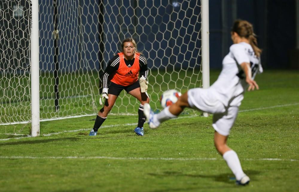 GVL / Kevin Sielaff - Gabriella Mencotti (20) tries a shot against Malone's goalkeeper.  Grand Valley defeats Malone in the first round of the GLIAC tournament with a final score of 6-0 Nov. 4 in Allendale.