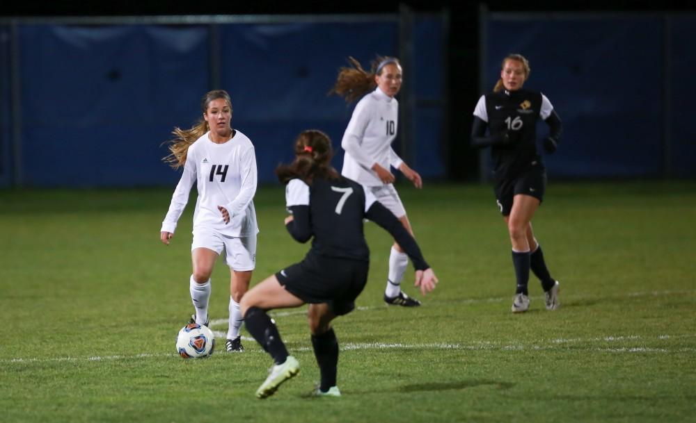 GVL / Kevin Sielaff - Mackenzie Fox (14) looks to send the ball up field.  Grand Valley defeats Ohio Dominican 3-0 in the semi-finals of the GLIAC tournament Nov. 6 in Allendale.