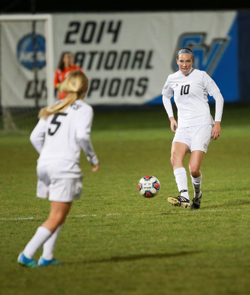 GVL / Kevin Sielaff - Shannon Quinn (10) sends the ball to Kendra Stuaffer (5).  Grand Valley defeats Ohio Dominican 3-0 in the semi-finals of the GLIAC tournament Nov. 6 in Allendale.