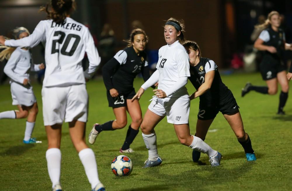 GVL / Kevin Sielaff - Marti Corby (13) fights to maintain posession of the ball.  Grand Valley defeats Ohio Dominican 3-0 in the semi-finals of the GLIAC tournament Nov. 6 in Allendale.