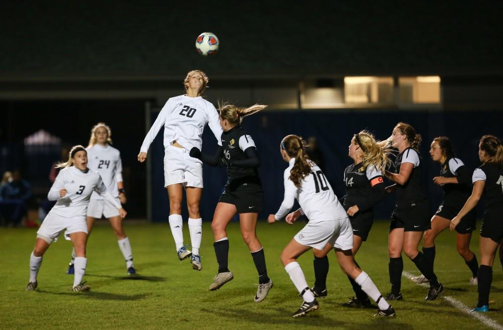 GVL / Kevin Sielaff - Gabriella Mencotti (20) tries to head the ball over the defensive line and into the goal.  Grand Valley defeats Ohio Dominican 3-0 in the semi-finals of the GLIAC tournament Nov. 6 in Allendale.